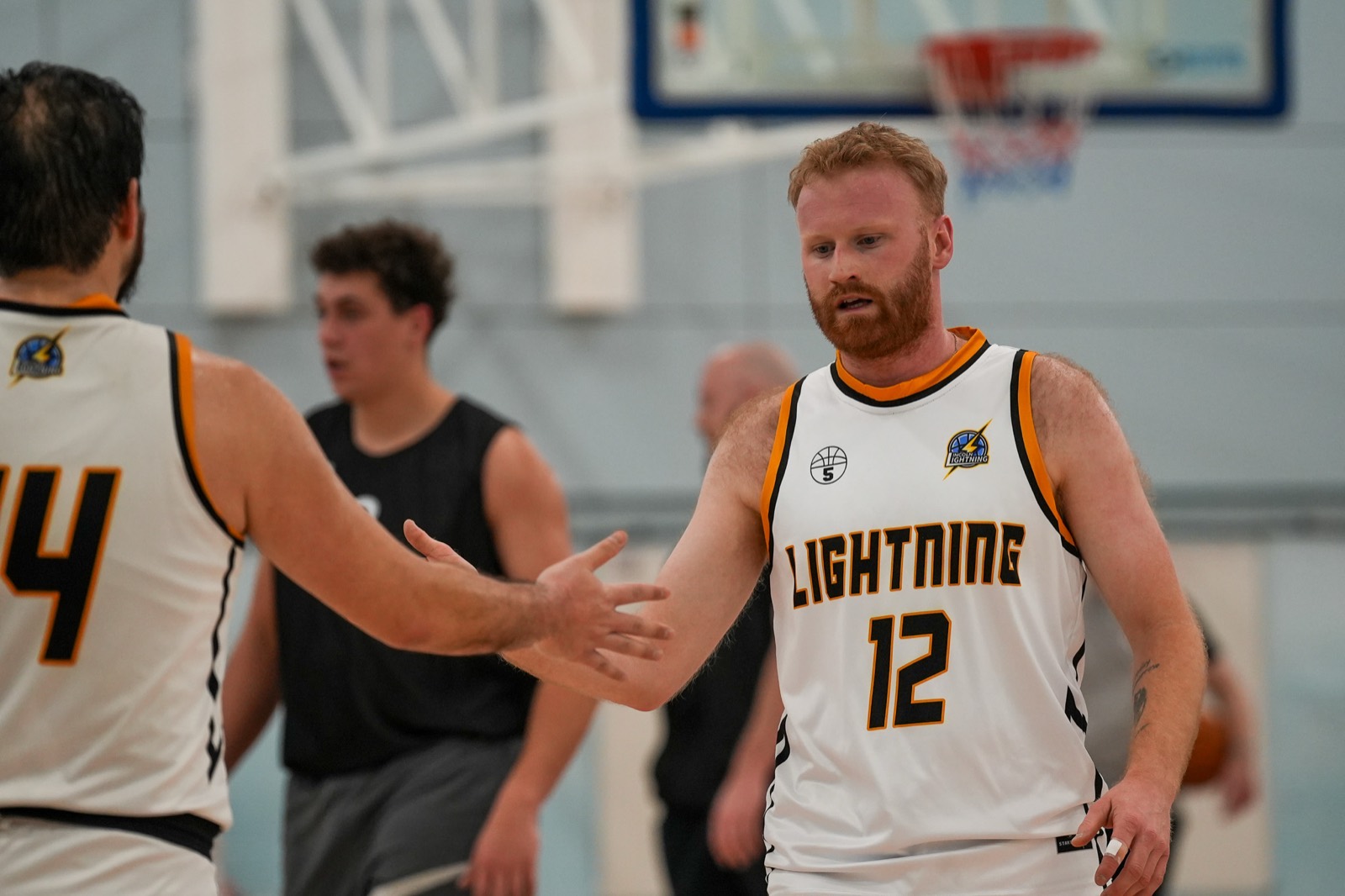 Two Lightning players shaking hands during a game