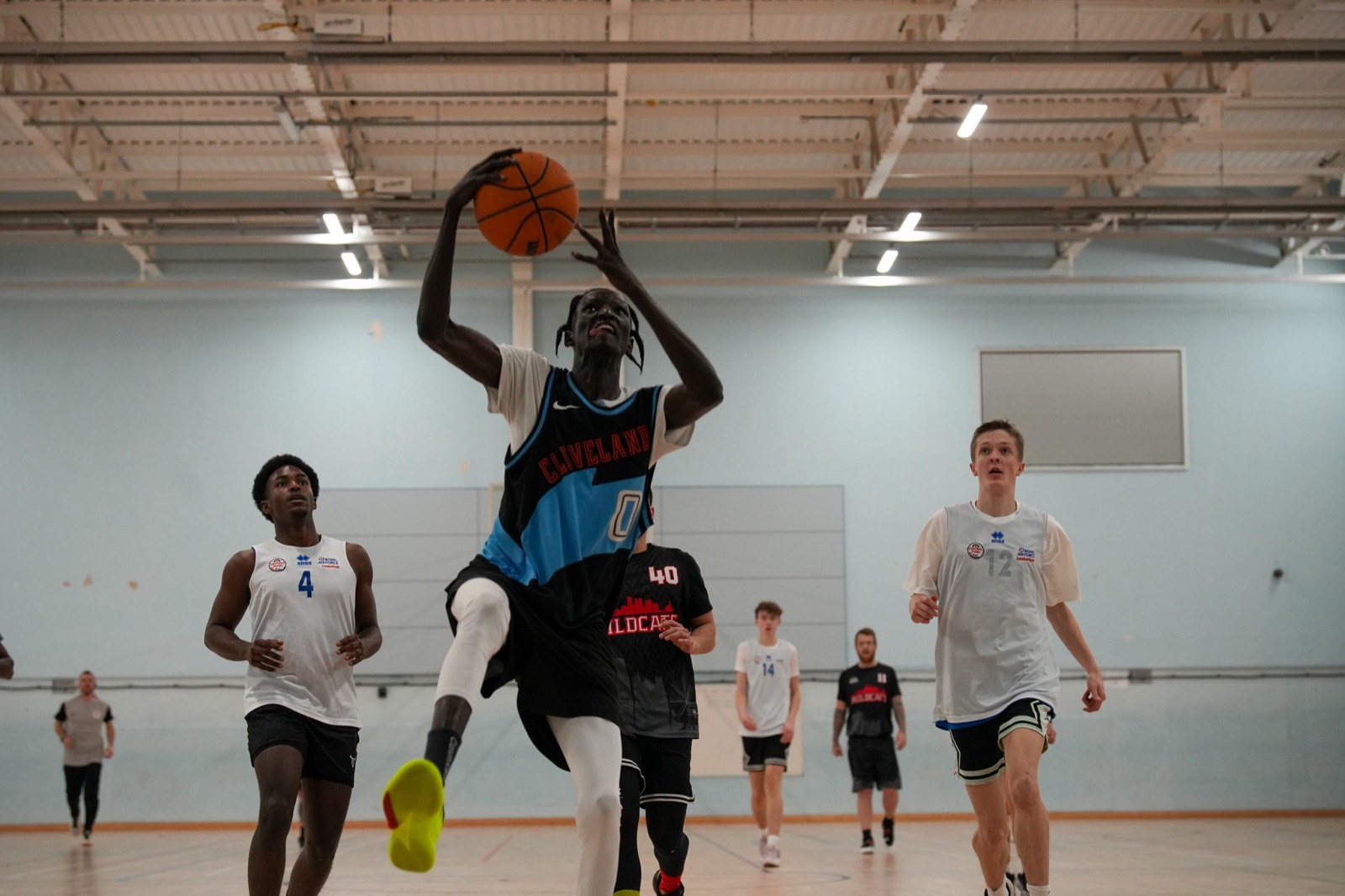 A player carrying the ball the length of the floor to finish